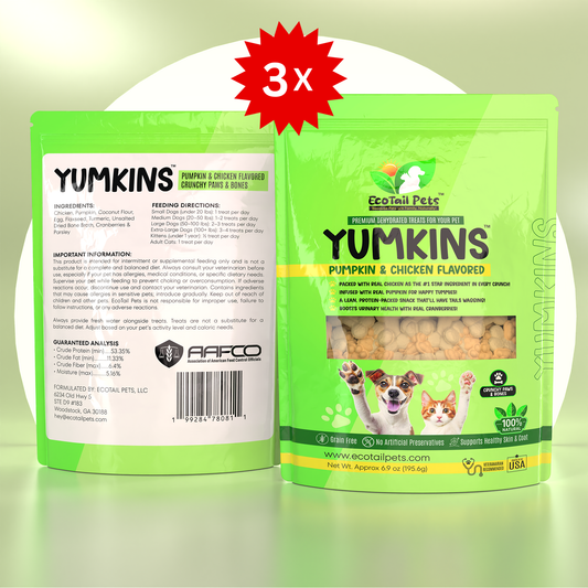 Package of Yumkins brand pumpkin and chicken flavored treats in the shape of paws and bones for cats and small dogs, with a subscription label indicating a bundle of three 6.9oz bags.
