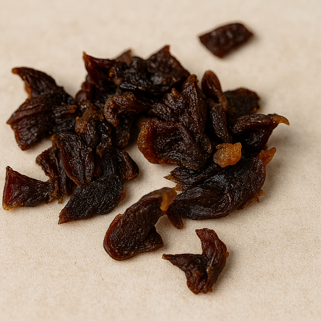 Dried duck jerky pieces on a beige background