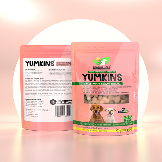 Packaging for Yumkins Sweet Potato & Bacon Flavored Bones for dogs. The package is pink with images of the product and dogs on it, along with nutritional information and a barcode.
